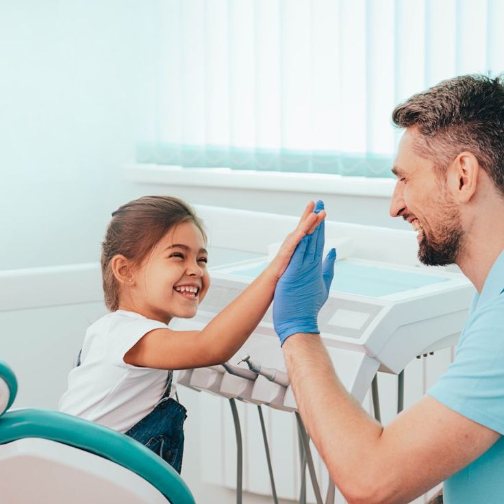 Dentist discussing oral health and dental treatment with a patient in Forest Hill